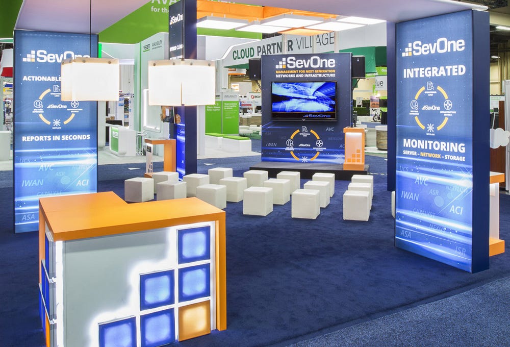 SevOne 30 x 30 custom trade show booth with lighting integration SevOne 30 x 30 custom trade show booth with lighting integration
